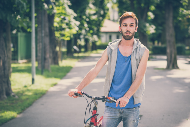 young hipster gay man with bike - Photo, Image