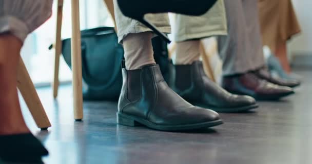 Business people, feet and job interview waiting room with nervous, excited or impatient group. row, job hunting and shoes of candidates in queue for company hiring, recruitment and job opportunity. - Felvétel, videó