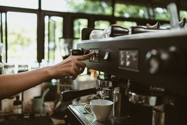espresso machine in coffee shop counter offering freshly brewed coffee. coffee maker concept. - Foto, immagini