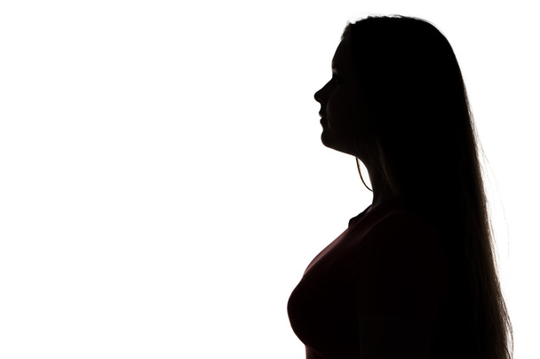 Silhouette of teenage girl looking away - Photo, Image