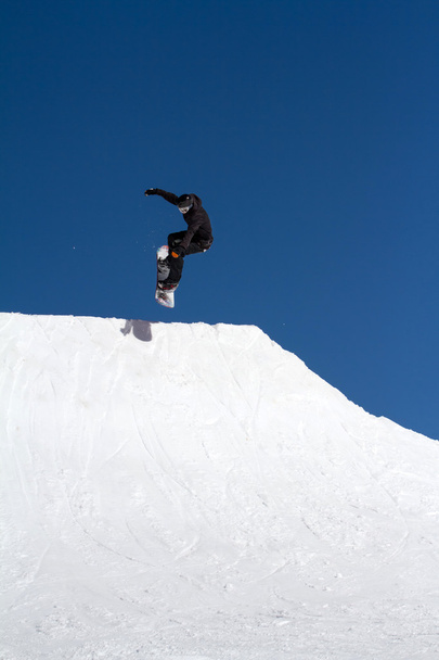 Snowboarder jumps in Snow Park,  ski resort - Fotografie, Obrázek
