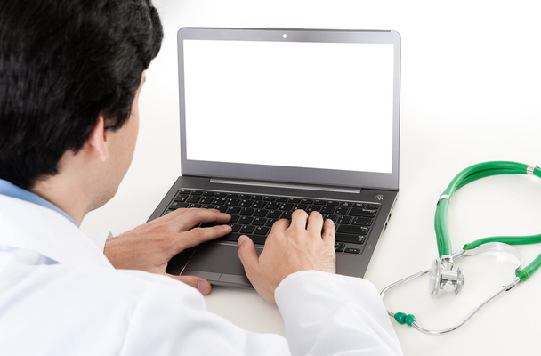 Rear view of a male doctor with laptop - Zdjęcie, obraz