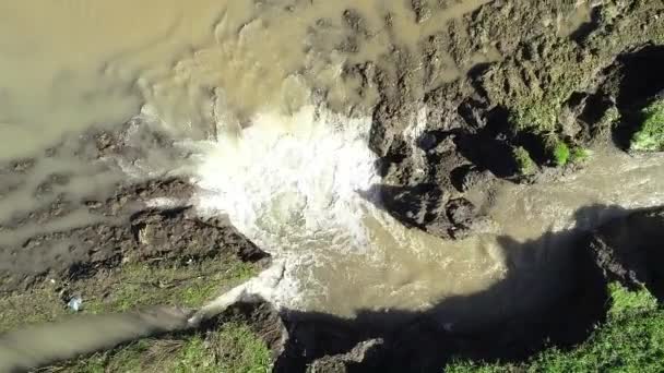 aerial view of underground sinkhole waterfall as water flows video - Materiał filmowy, wideo