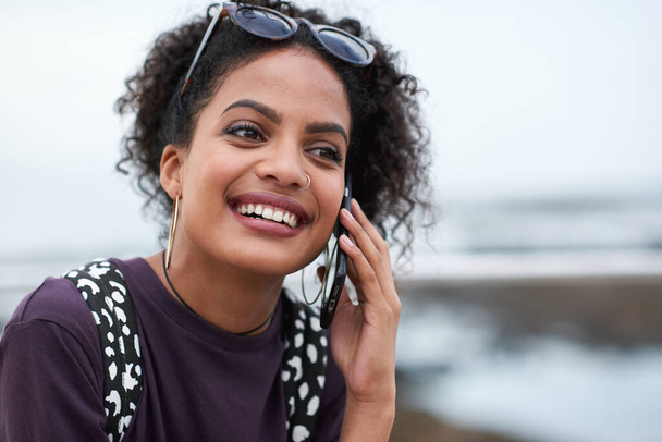 Phone call, beach and black woman with communication, news or 5g networking for opportunity and online talking. Happy gen z or USA person on smartphone conversation by ocean or sea for a holiday chat. - Foto, immagini