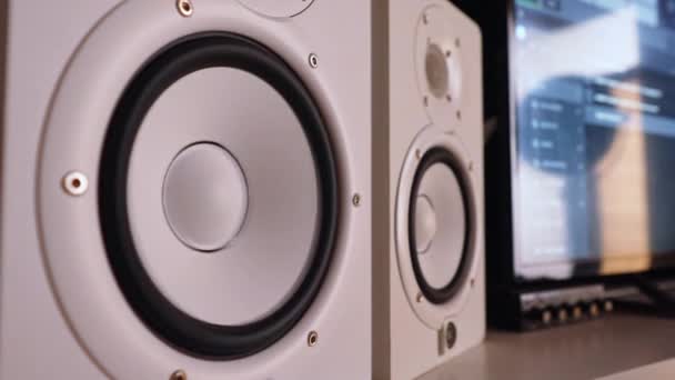 Professional white studio monitors vibrating, playing music. High quality 4k footage - Felvétel, videó