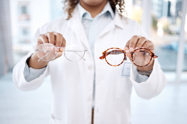 Eye care, vision and woman, choice of glasses in hands, optometrist and healthcare for eyes with doctor. Prescription lens, designer frame and eyewear decision, health insurance and optometry. - Foto, afbeelding