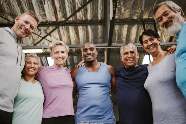 Senior people, fitness portrait and group support for training, workout or exercise community or gym club. Personal trainer and elderly, diversity circle in sports wellness, hug together for teamwork. - Fotoğraf, Görsel