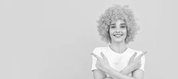 Woman isolated face portrait, banner with copy space. happy woman in curly wig. express positive emotions. cheerful lady wear wig - Photo, Image