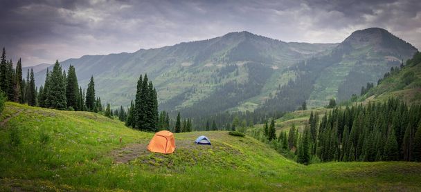 Panoramic view of Colorado landscape, Camping tent in the middle of rocky mountain wilderness, near Crested Butte. - Fotó, kép