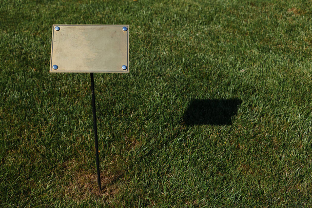 Golden plaques for writing on the territory of the park - Photo, Image
