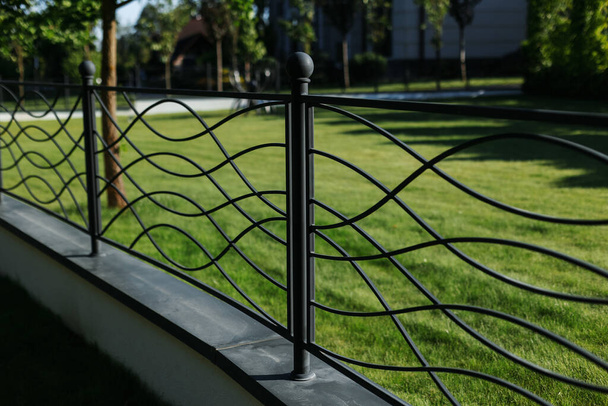 Metal fence in the landscape design of the park - Foto, Bild