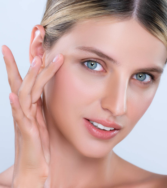 Closeup alluring beautiful woman with perfect smooth and clean skin portrait in isolated background. Beauty hand gesture with expressive facial expression for skincare treatment product or spa. - Foto, afbeelding