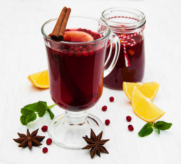 Glasses of mulled wine with lemon and cranberries - Photo, Image