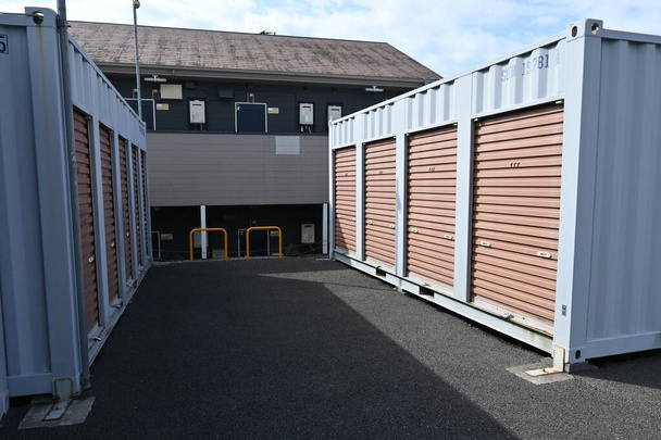 The rental self storage room unit. This is a rental storage space for temporary or long-term luggage storage, popular for outdoor and sporting goods, as well as books and off-season clothing. - Foto, immagini