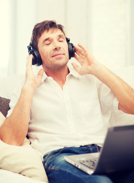 man with headphones listening to music - Фото, изображение