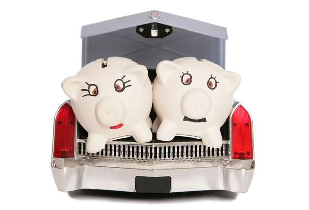two piggy banks in car boot  - Photo, Image