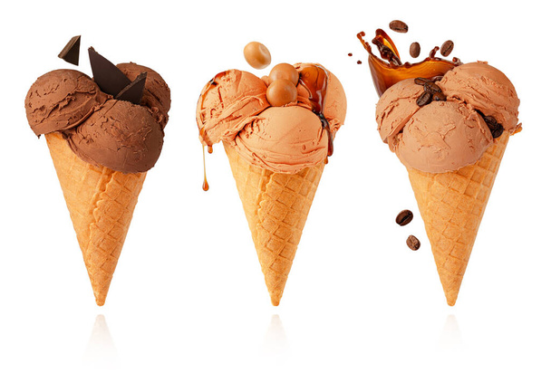 Set of waffle cones with chocolate, caramel and coffee ice cream isolated on white background with clipping path. - Valokuva, kuva