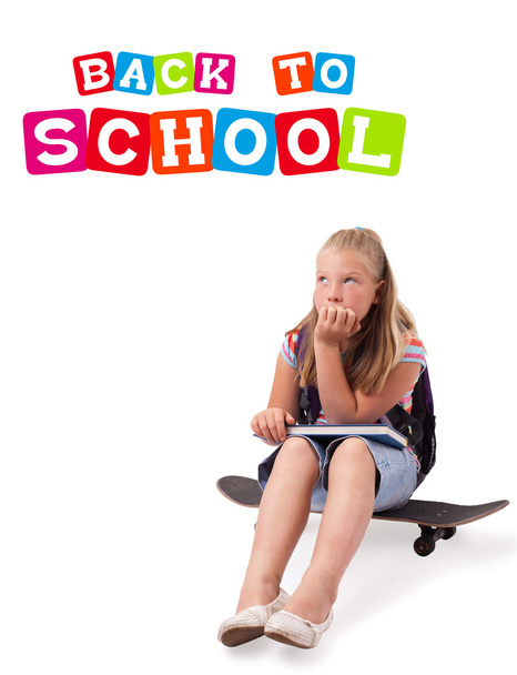 Girl on skateboard with back to school theme isolated on white - Foto, immagini