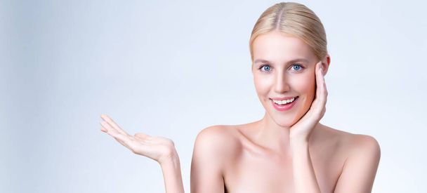 Personable beautiful woman with perfect smooth and clean skin portrait in isolated background. Beauty hand gesture with expressive facial expression for skincare treatment product or spa. - Fotoğraf, Görsel