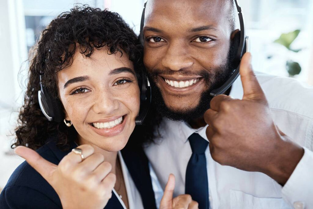 Call center selfie, business people and thumbs up with smile for teamwork, motivation and success in crm job. Black man, woman and yes hand sign for social media, team building and consulting goals. - Fotografie, Obrázek