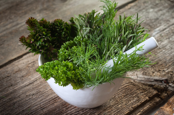 Aromatics herb over mortar-erbe e mortaio - Fotó, kép