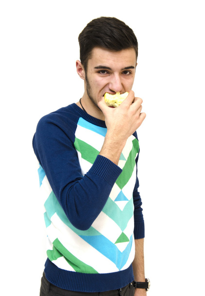 Adolescente comiendo manzana
 - Foto, Imagen