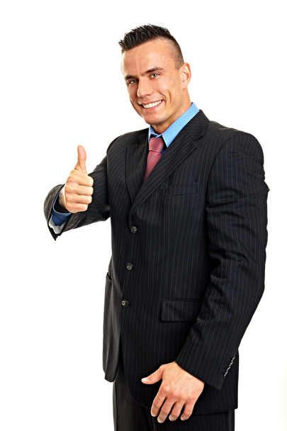 Smiling man showing thumb up - Fotó, kép