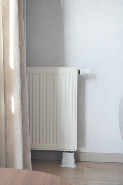 heating radiator under window in the room. High quality photo - Photo, Image