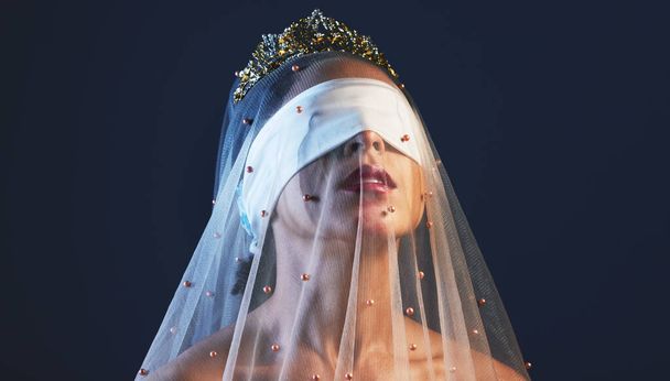 Blindfolded, princess and woman in veil studio for creative, fashion or artistic aesthetic on black background. Model, medieval and crown beauty by girl model in luxury, fabric and elegant clothing. - Photo, image