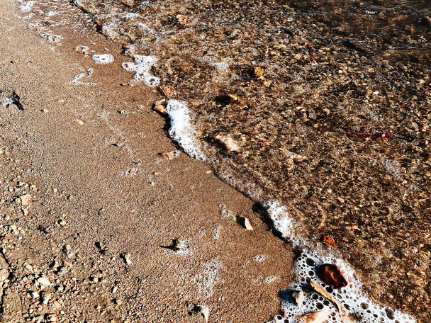 a riverside shore coast water wave foam coastal ocean beach waves pebble sea - Foto, immagini
