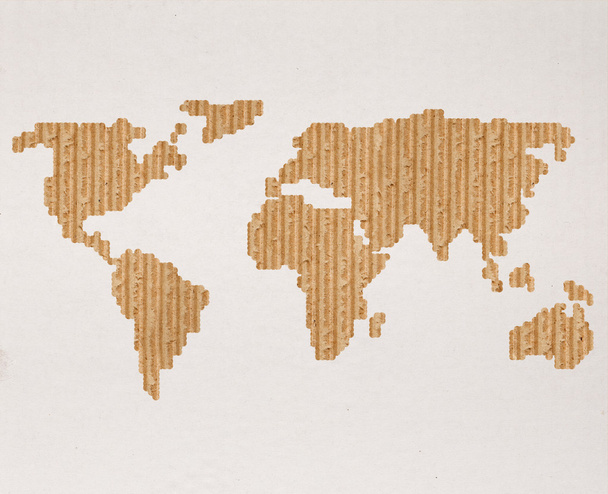 Концепция глобальной доставки с картонной картонной картой мира
 - Фото, изображение