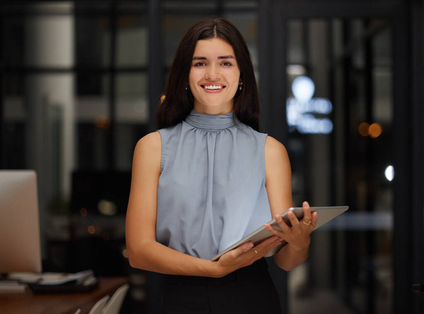 Happy, night and tablet with portrait of woman in office for search, communication and digital management. Contact, technology and smile with employee for website, networking and social media app. - Fotoğraf, Görsel