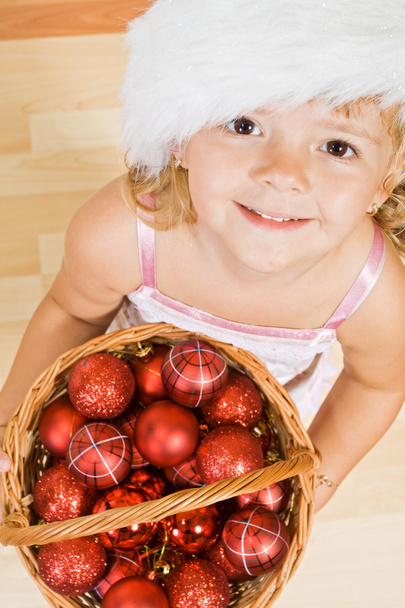 Little girl with christmas balls - Photo, image