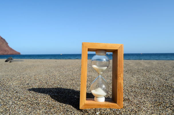 Hourglass on a Beach - Photo, Image