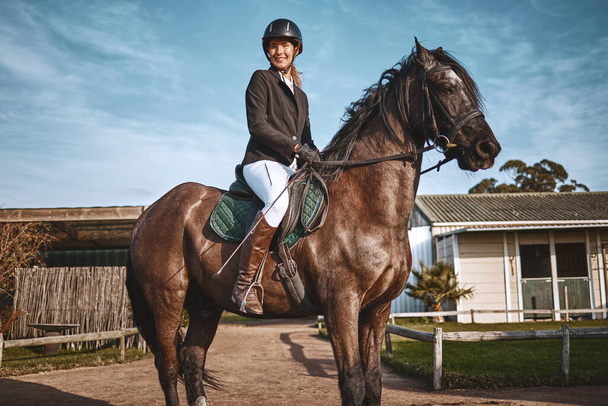 Equestrian, hobby and portrait of woman on horse for a ride, recreation and lessons on a farm. Sports, exercise and girl doing horseback riding for a competition, learning or training in countryside. - Foto, Imagen