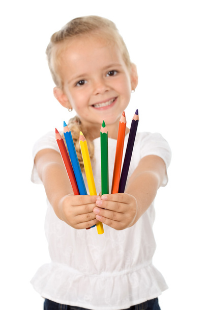 Little girl with lots of pencils - smiling - Photo, image