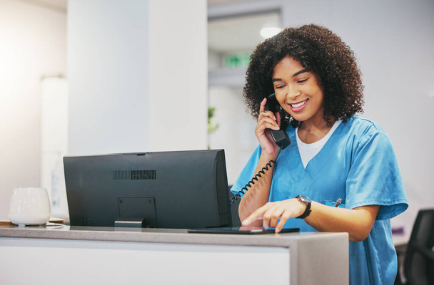 Nurse, phone call and tablet of black woman at hospital with a smile. Clinic doctor, healthcare worker and networking of a young person happy about work conversation and health insurance talk. - Foto, Bild