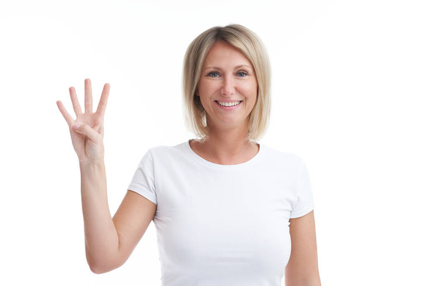 Picture of blonde woman over back isolated background counting on fingers. High quality photo - Foto, Imagem