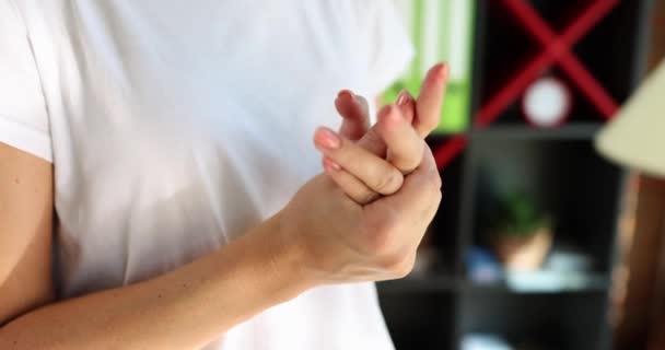 Female hands nervously fingering each other, closeup, slowmotion. Concerned gestures, shallow focus - Felvétel, videó