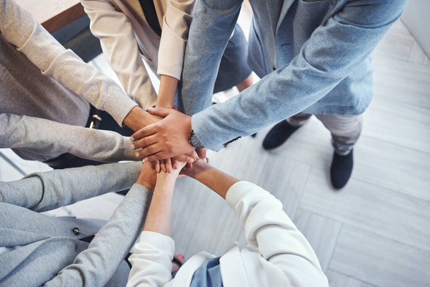 Diversity, stack of hands and business people in the office in unity, collaboration and teamwork. Multiracial, corporate and professional team with motivation, support and connection in the workplace. - Foto, Imagen