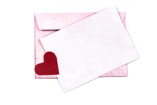 Isolated open vintage envelope with pink pages and heart - Fotografie, Obrázek