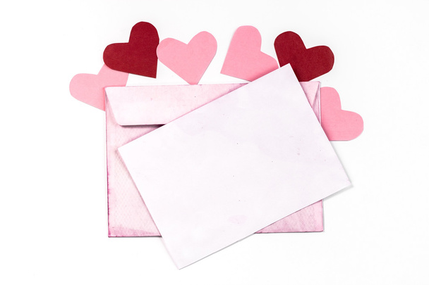 Isolated open vintage envelope with pink pages and heart - Fotografie, Obrázek