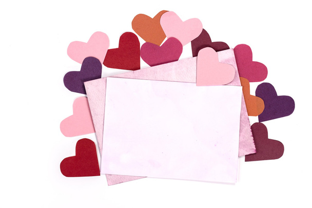 Isolated open vintage envelope with pink pages and hearts - 写真・画像