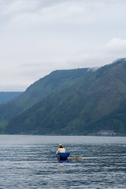 view of the horizon of lake toba in the morning with cloudy weather - Photo, image