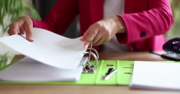 Woman manager putting documents in folder closeup 4k movie slow motion. Custody of securities concept - Video, Çekim
