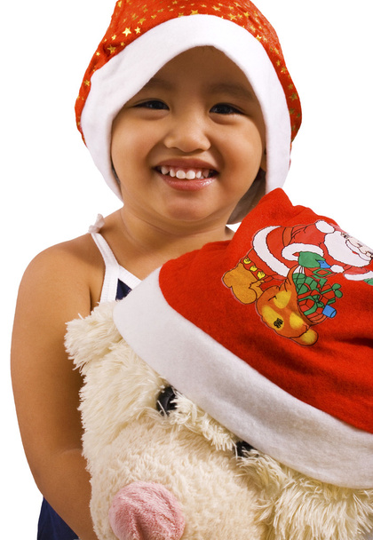Молодая девушка и мягкая игрушка носить Санта-Шляпы
 - Фото, изображение