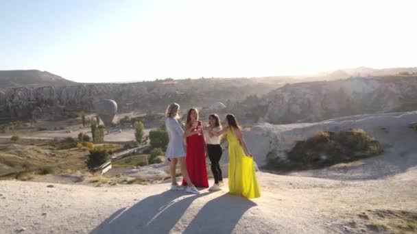 Women cheers in Valley of Cappadocia, Sunset view, Drone panoramic footage. High quality FullHD footage - Video