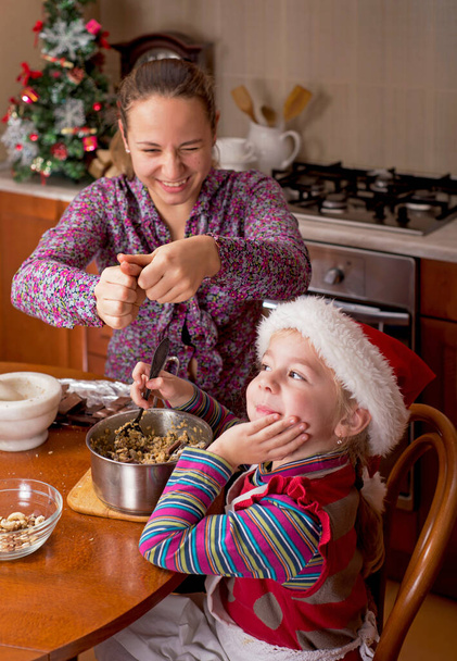 Christmas atmosphere. Children drink tea - Фото, зображення