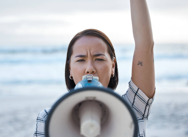 Megaphone, climate change protest and Asian woman at beach protesting for environment, global warming and to ocean stop pollution. Save the earth, activism and angry female shouting on bullhorn - Foto, Bild
