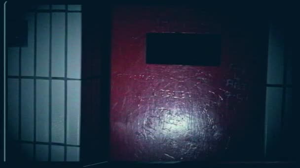 Prison door in prison cell on faulty CCTV glitching grainy monitor effect 4k shot selective focus - Filmmaterial, Video